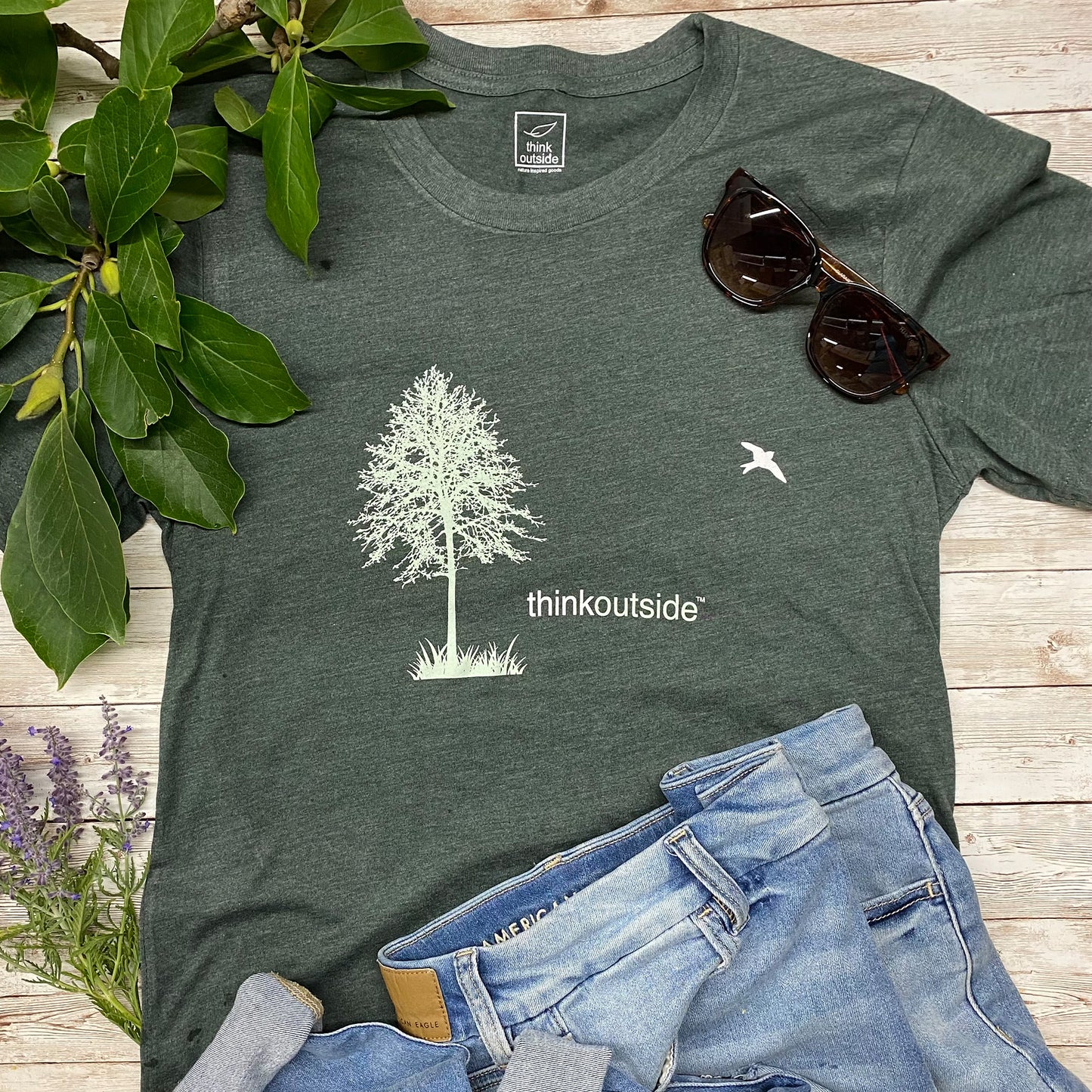 Super soft, heather forest green arboretum and gardening  graphic unisex tee with tree silhouette for nature lovers.  Features the phrase Think Outside.