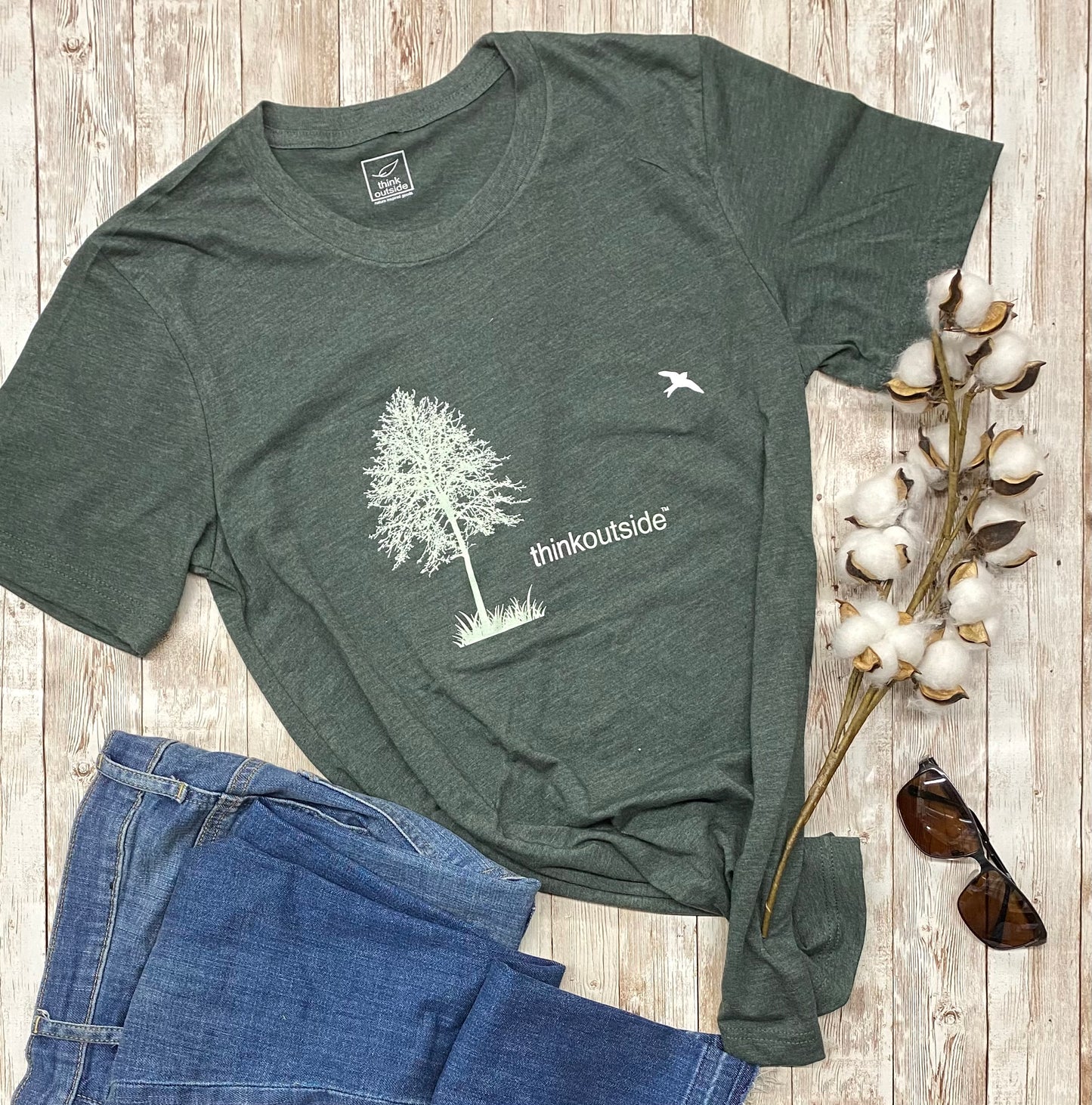 Super soft, heather forest green outdoor and  hiking graphic unisex tee with tree silhouette.  Features the phrase Think Outside.